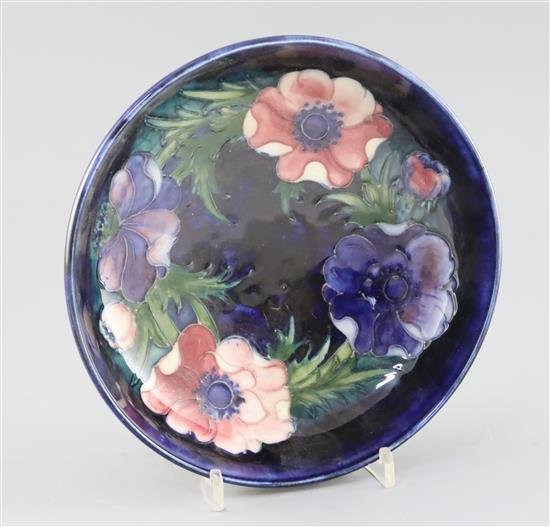 A Moorcroft anemone cobalt blue ground bowl, c.1950, diameter 22.3cm